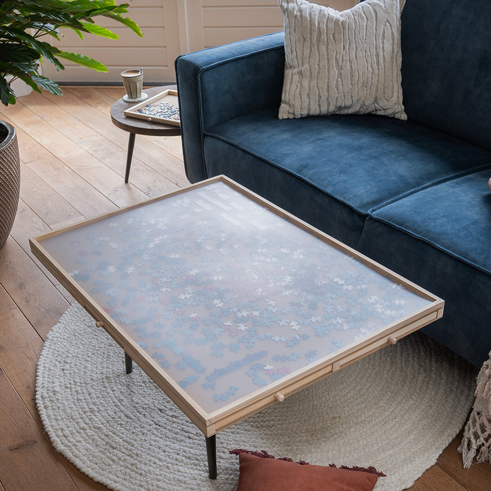 Puzzelplaat afgedekt met de transparante beschermhoes