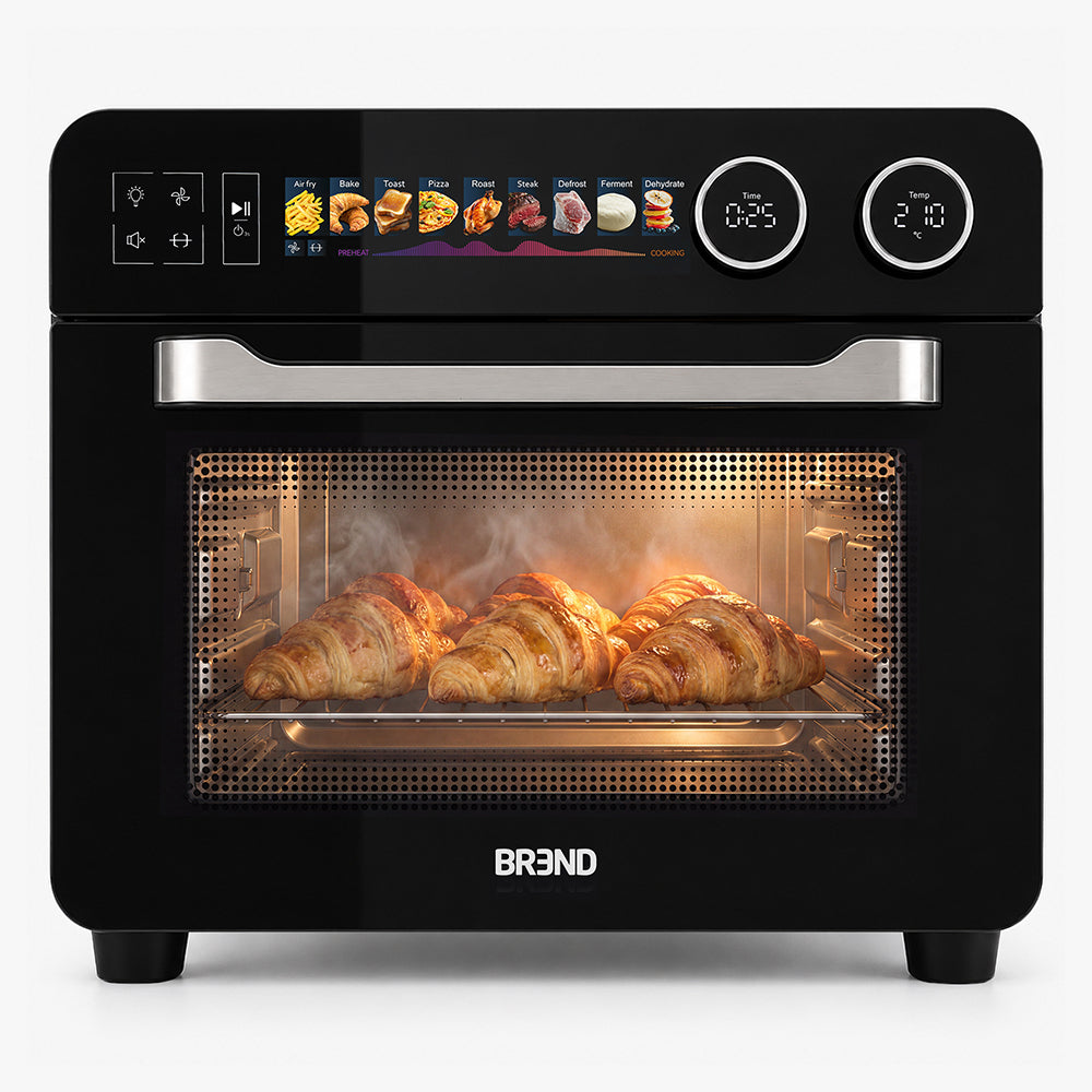 Zwarte BREND Combi Airfryer Oven met croissants achter de glazen deur, vooraanzicht