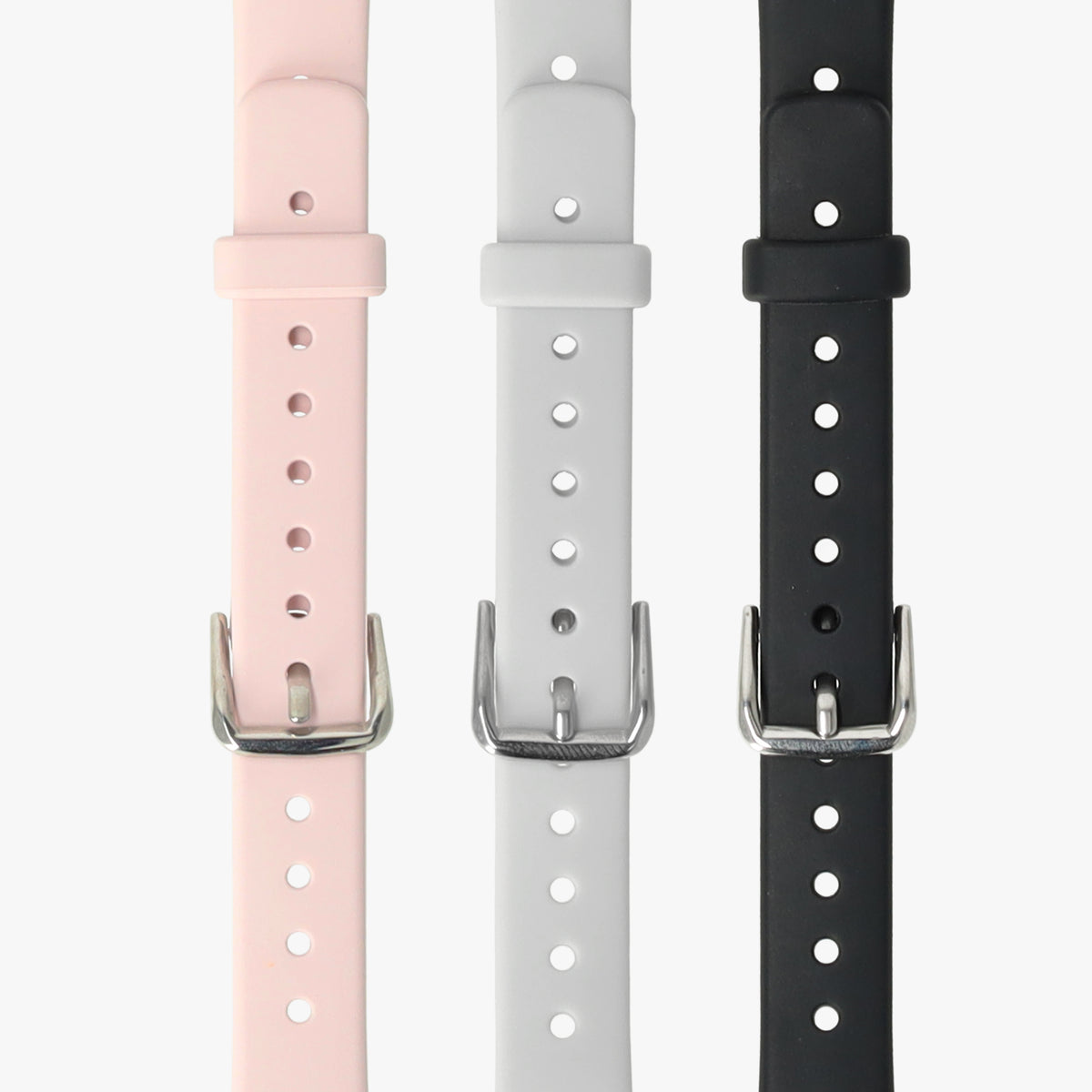 Horlogebandjes voor de activity tracker in roze, lichtgrijs en zwart naast elkaar